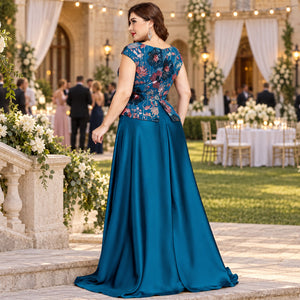 Full-length teal blue floral evening dress styled for a formal occasion