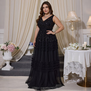Plus size black evening gown side view ruffle layered detail