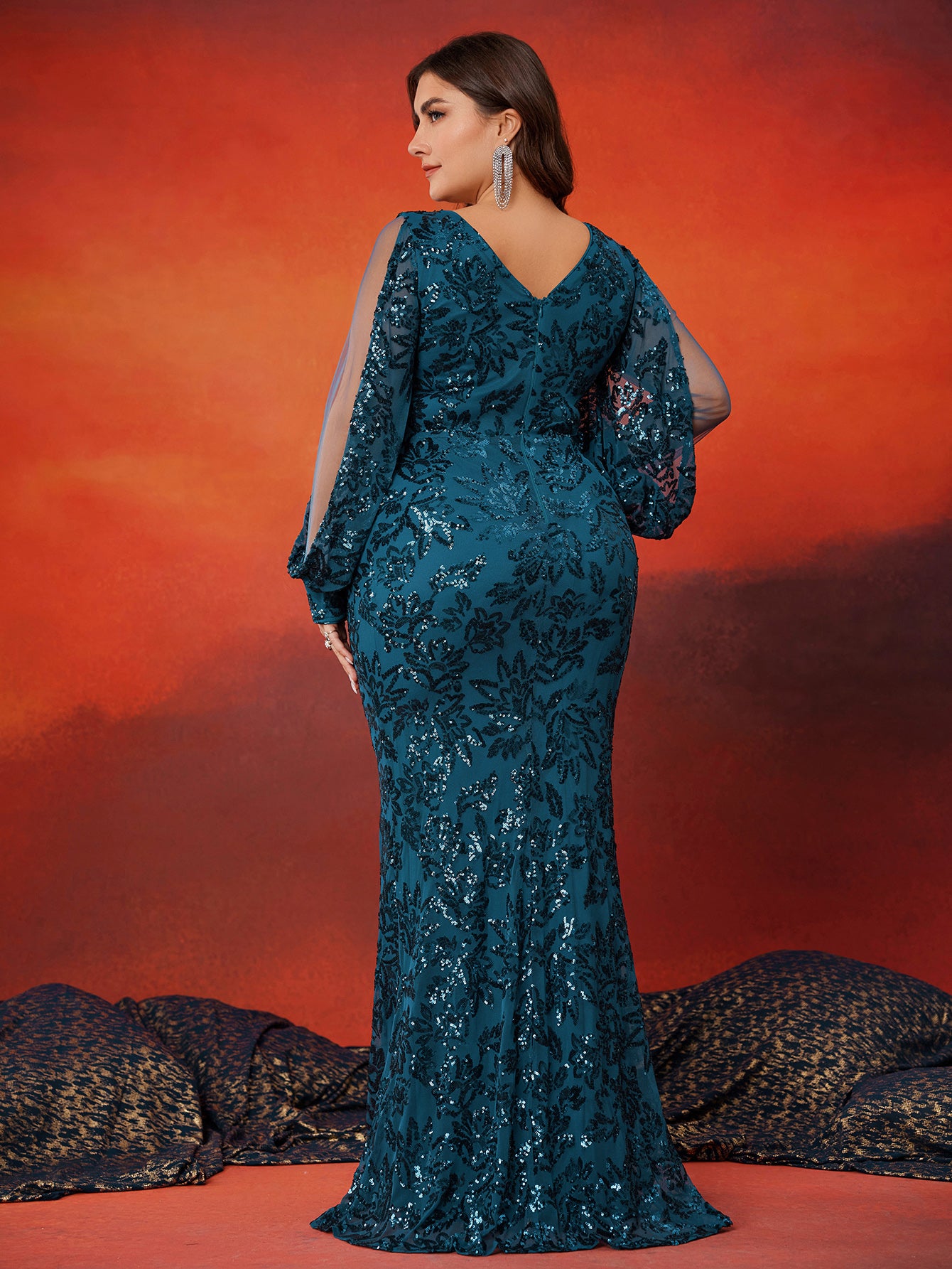 Back view of plus‑size teal sequin long sleeve mermaid formal evening gown