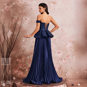 A model showcasing the flowing pleated skirt of a peacock blue off-the-shoulder sequin gown, a perfect choice for formal dinners and evening receptions.