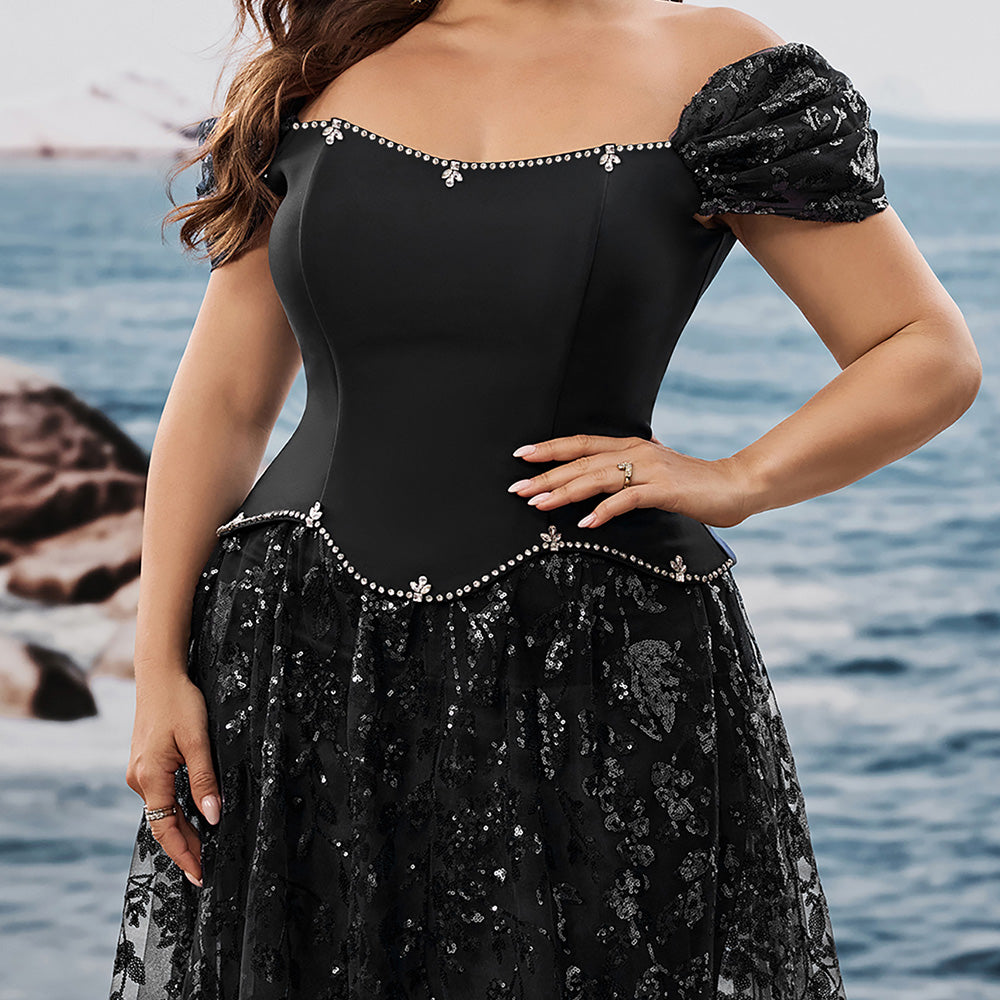 Close-up of a formal skirt and bodice, showcasing the beaded trim, off-the-shoulder design, and flowing sequin mesh overlay.