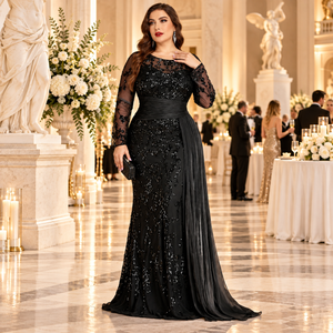 Front view of a plus size black sequin mermaid evening gown with ruched waist and sheer sleeves at a charity gala